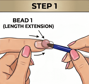 Step 1 of the acrylic 3-bead method, showing a nail technician using a blue-handled brush to apply the first bead at the free edge to build the length extension and C-Curve.